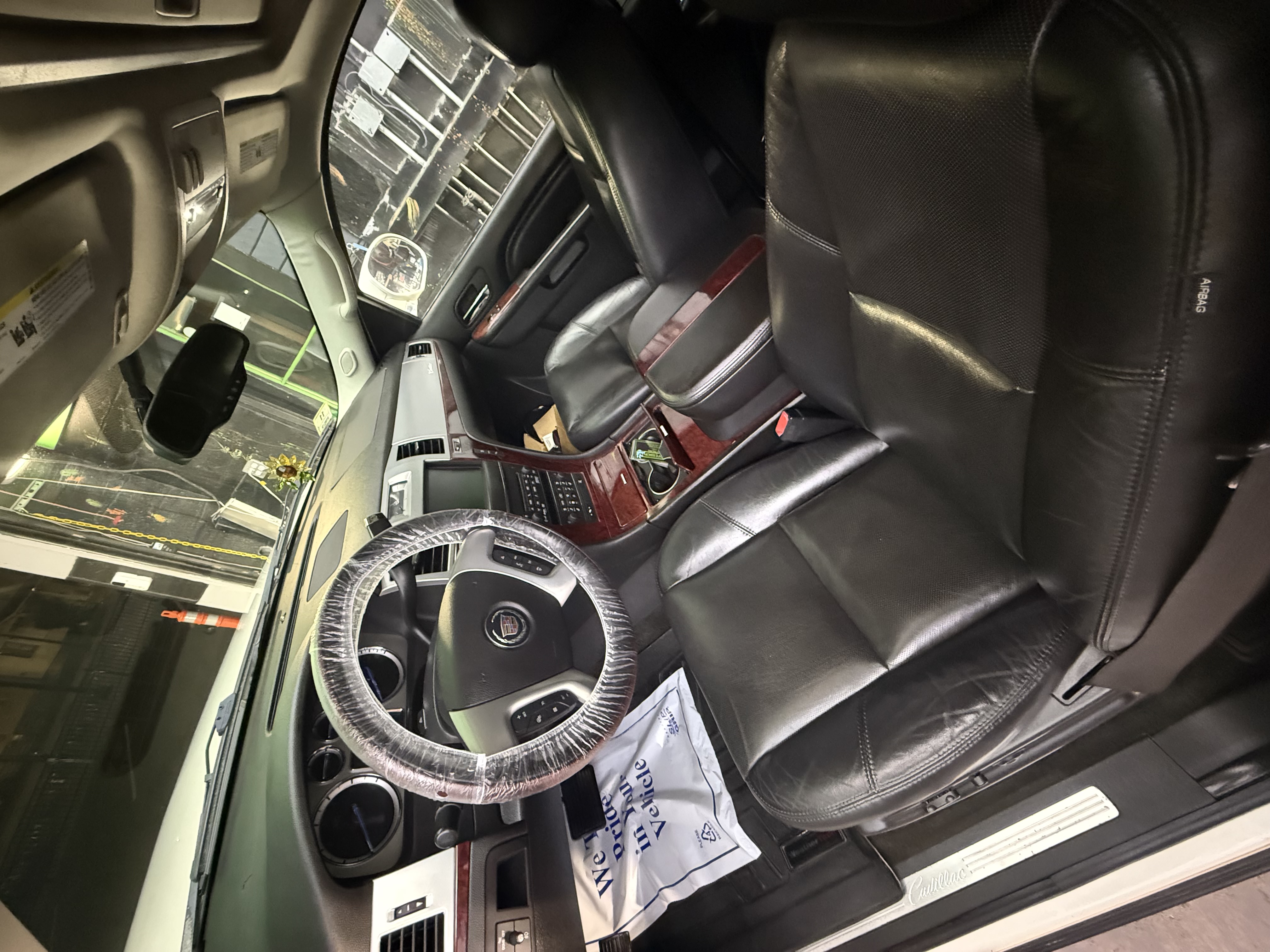 Luxury SUV interior with protective covering during detailing