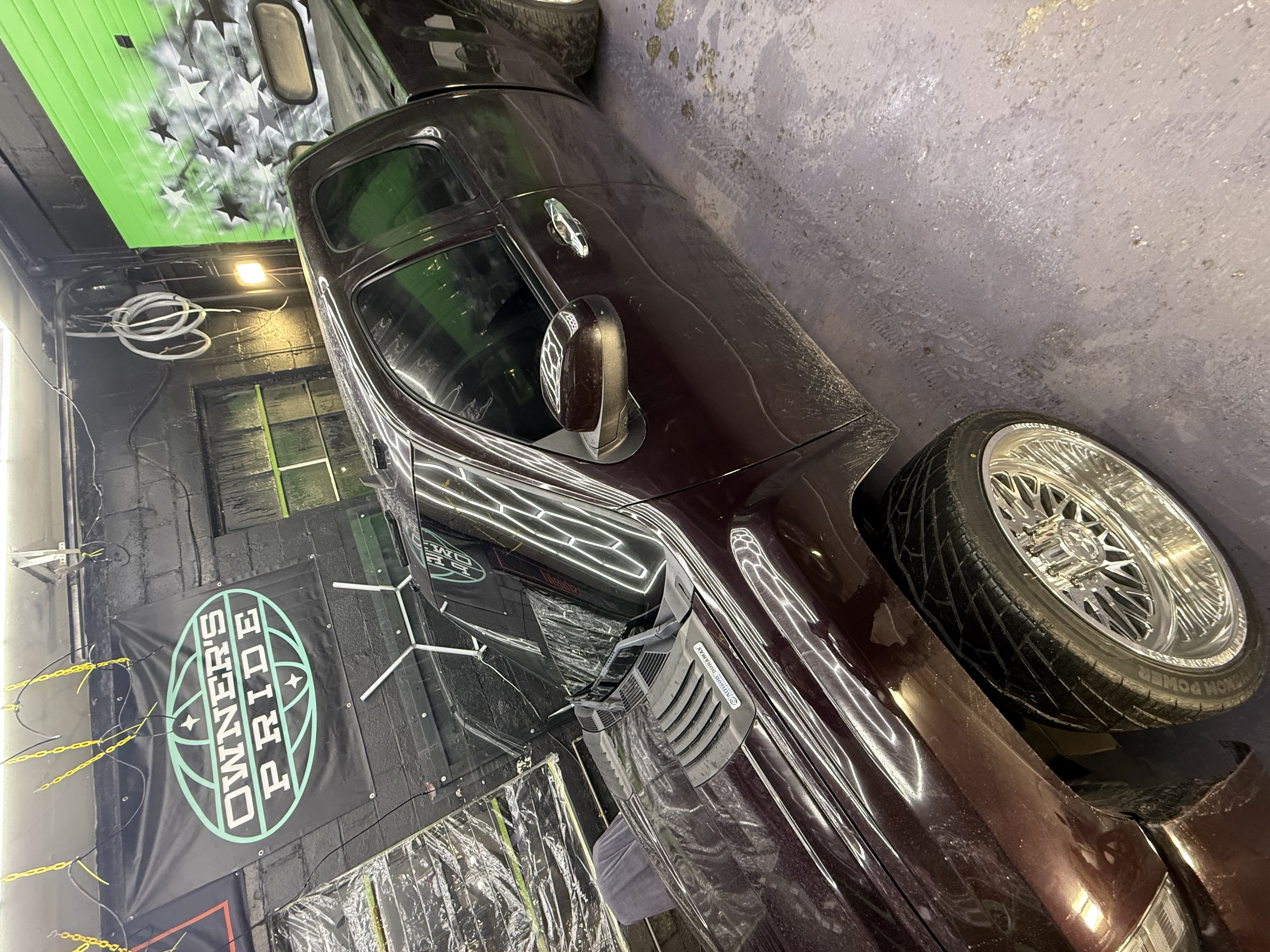 Luxury sedan in professional detailing garage